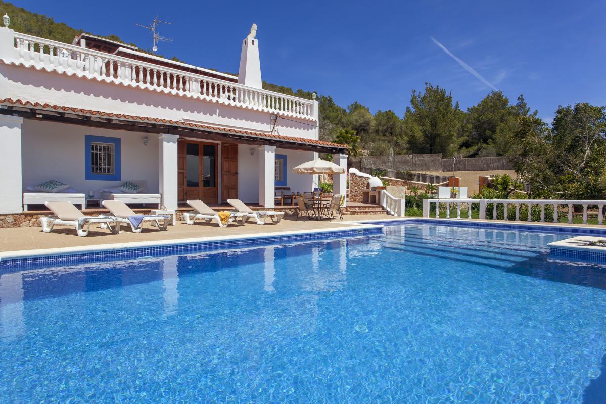 Pool and sunbeds area and house rental